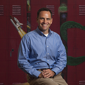 man in front of lockers